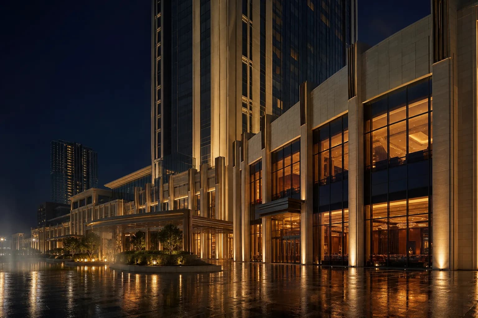 Midnight Resort illuminated at night across a reflective plaza
